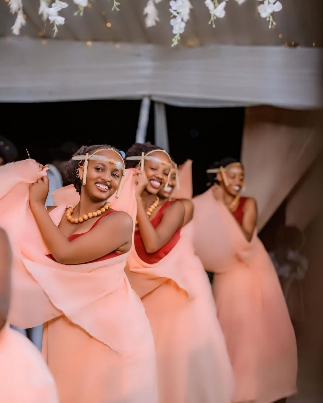 Bride and groom celebrating with the troupe