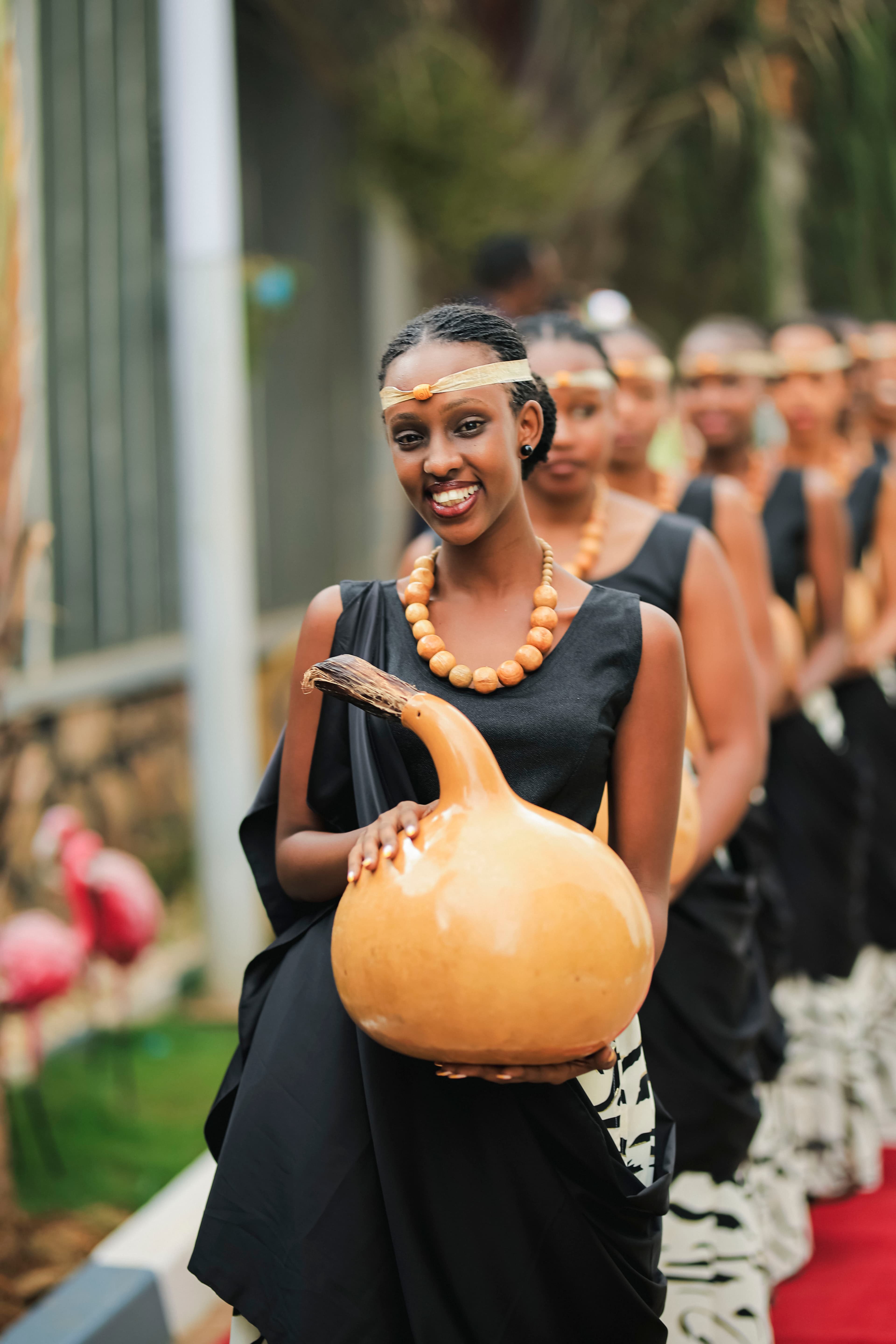 Inkumburwa performer carrying a traditional gourd