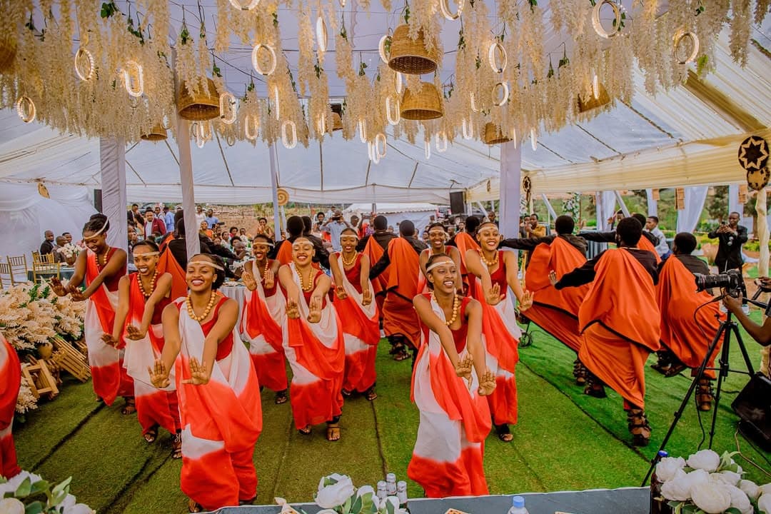 Wedding guests enjoying traditional performance